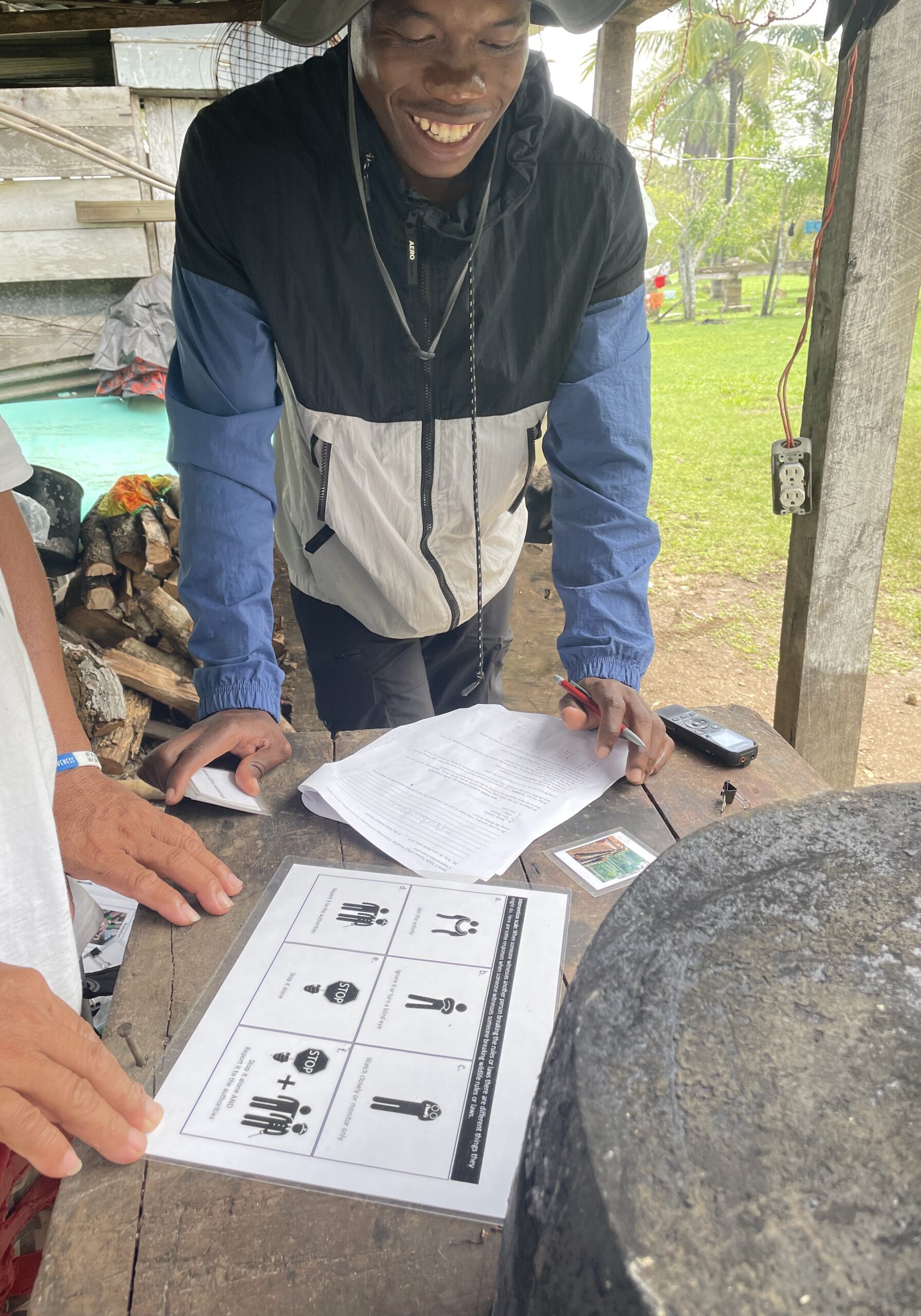 Guardianship Interntion Excercise Two people leaning over documents on a table having a conservation during interview
